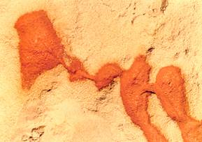 zoom in photo of red clay from Gay Head cliffs on sand 