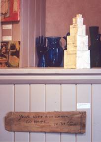 Origami "Building Blocks" constructed from blueprints donated by Peter Breese.  Shingle reads "Your wife is in labor.  Go home," donated by Julie Sierputoski, written and left for her husband Arthur.